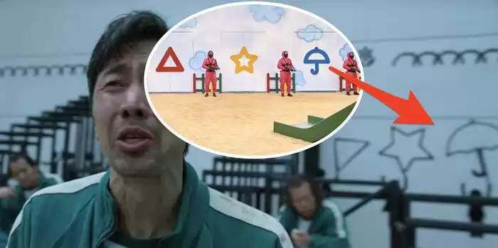 Cena famosa da prova final na série Round 6 onde o participante é obrigado a escolher a forma do guarda-chuva. 